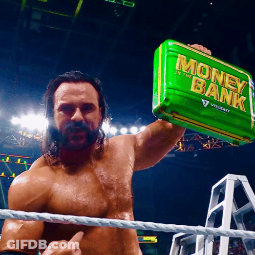 Wrestler Holding Green Money Bank GIF