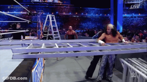 Wrestler Holding Ladder Another Behind GIF