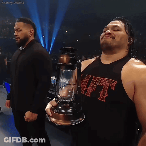 Wrestler Holding Lantern With HT Shirt GIF