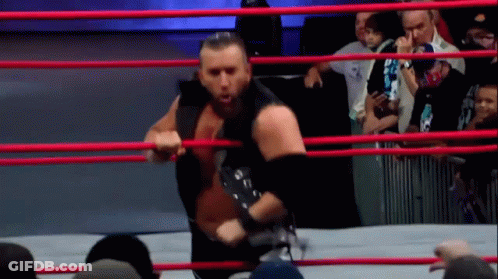 Wrestler Holding Rope In Ring GIF