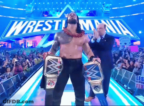 Wrestler Holding Two Championship Belts At WrestleMania GIF