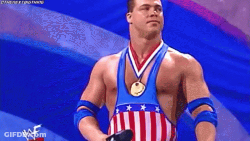 Wrestler In American Flag Outfit With Medal GIF