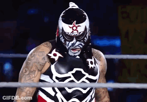 Wrestler In Black And White Costume With Star On Head GIF