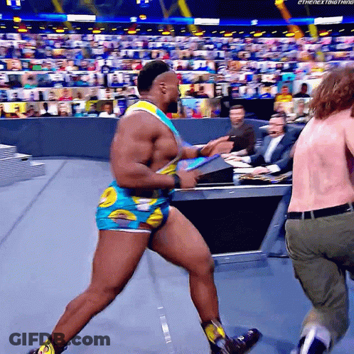 Wrestler In Blue And Yellow Outfit Running GIF
