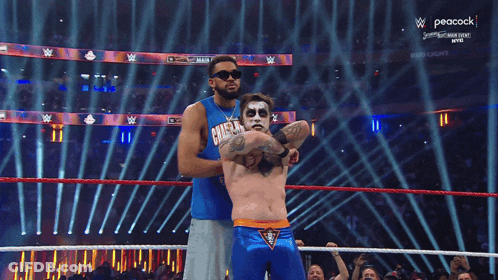 Wrestler In Blue Shirt Saying Champion GIF
