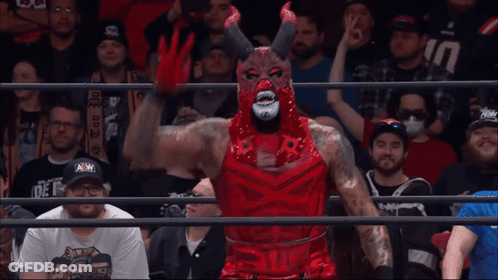 Wrestler In Devil Costume Before Crowd GIF