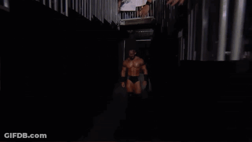 Wrestler In Front Of Crowd With Supercard Sign GIF