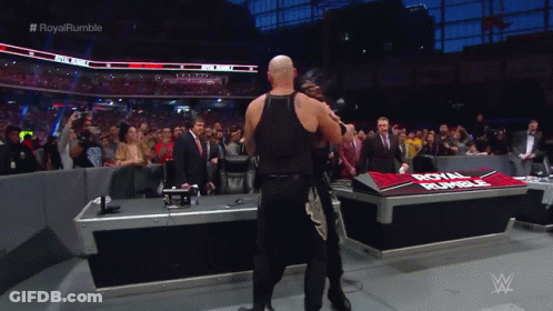 Wrestler In Front Of Royal Rumble Table GIF
