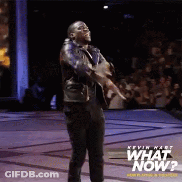 Wrestler In Front Of Wrestlemania Sign GIF