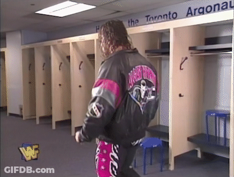 Wrestler In Locker Room With Toronto Argonaut Sign GIF