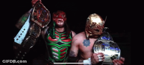 Wrestler In Purple And Green Walking Down Runway GIF