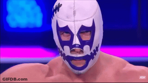 Wrestler In Purple And White Mask With Mouth Hole GIF
