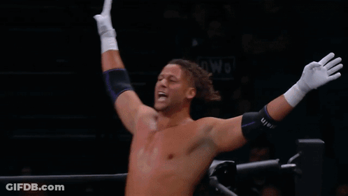 Wrestler In Purple Pants Laying In Ring GIF