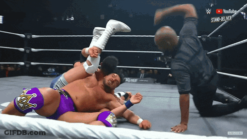 Wrestler In Purple Shorts Being Pinched GIF