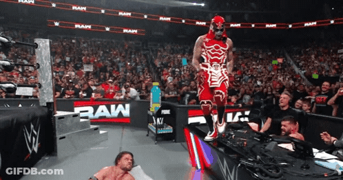 Wrestler In Red And White By RAW Sign GIF