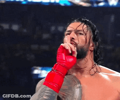 Wrestler In Red Glove Covering Mouth GIF