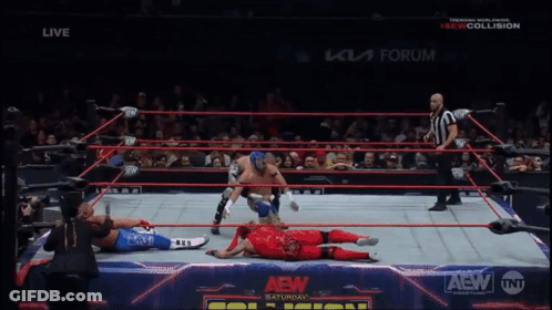 Wrestler In Red Kicking Another Wrestler GIF