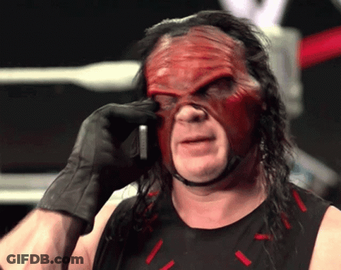 Wrestler In Red Mask And Black Gloves On Phone GIF