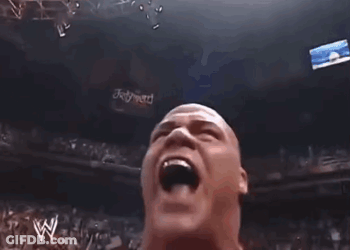 Wrestler In Red Star-Sleeved Jacket Talking Into Microphone GIF