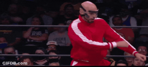 Wrestler In Red Suit Doing Flip GIF