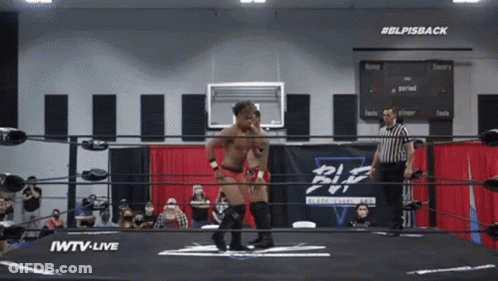 Wrestler In Ring With #BLPIsBack Sign GIF