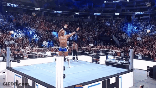 Wrestler In Ring With Crowd And Not Mercy Sign GIF
