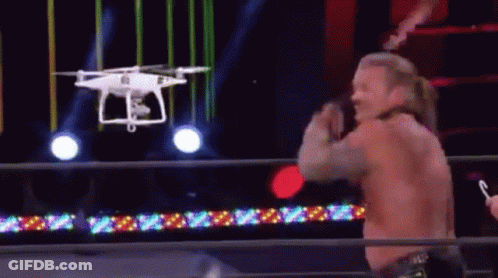 Wrestler In Ring With Drone Overhead GIF