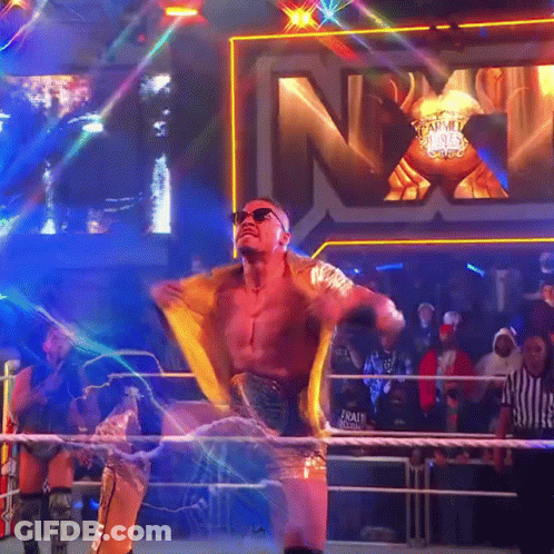 Wrestler In Ring With NXT Sign GIF