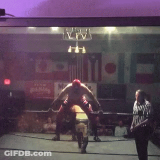 Wrestler In Ring With Referee And Happy Sign GIF