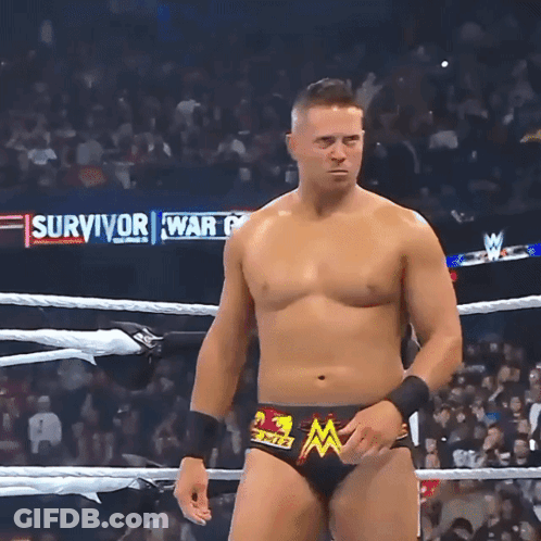 Wrestler In Ring With Survivor War Behind Him GIF
