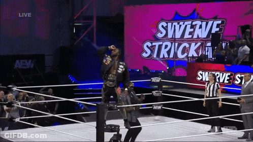 Wrestler In Ring With Swerve Strick Screen GIF