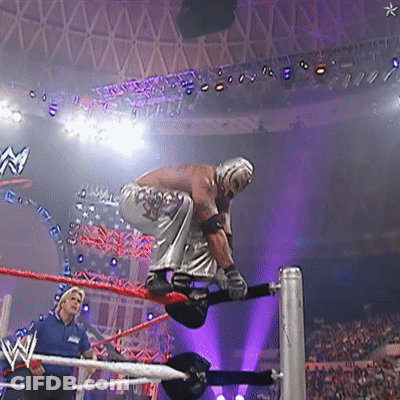 Wrestler In Ring With W Logo On Ceiling GIF