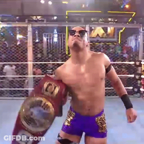 Wrestler In Sunglasses Holding Championship Belt GIF