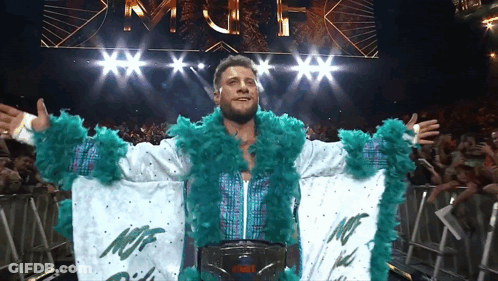 Wrestler In White And Green Outfit Saying NCF GIF