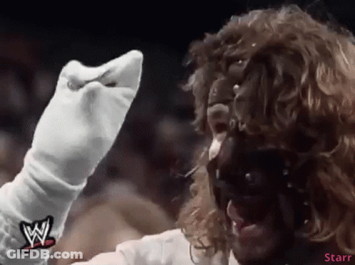 Wrestler In White Gloves And Mask With W Logo GIF