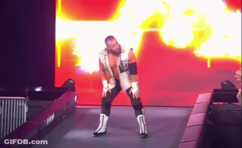 Wrestler In White Vest And Black Pants Dancing GIF