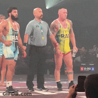 Wrestler In Yellow Tank Top Saying Raf GIF