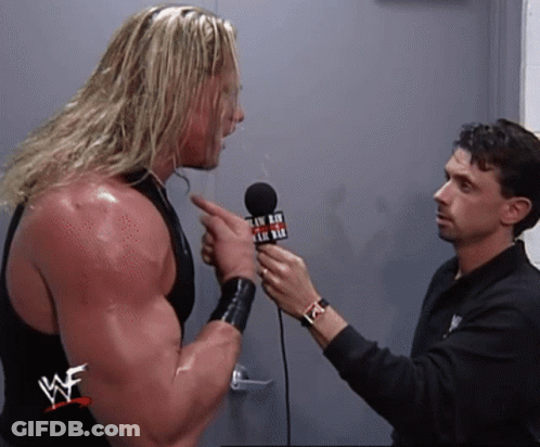 Wrestler Interviewed By Man In WWE Shirt GIF