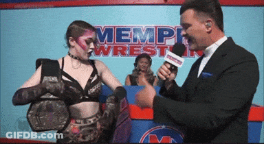 Wrestler Interviewed In Front Of Memphis Sign GIF