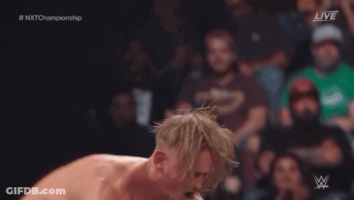 Wrestler Jumping Over Another In Ring With Referee GIF