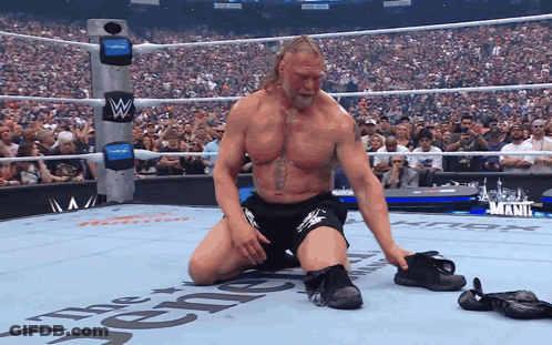 Wrestler Kneeling In Wrestling Ring The Renegade GIF