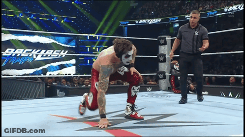 Wrestler Kneeling In Wrestling Ring With Backlash GIF