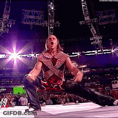 Wrestler Kneeling With Mouth Open In Front Of XII Sign GIF
