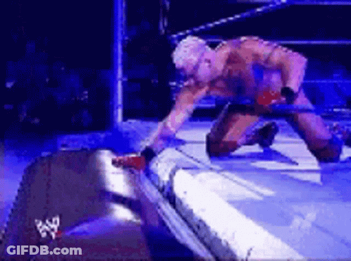 Wrestler Kneeling With Sword GIF