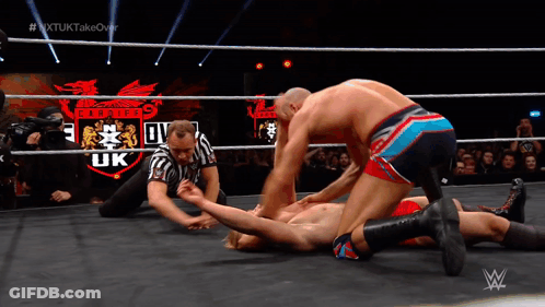 Wrestler Laying In Ring With Pirates UK Logo GIF