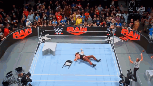 Wrestler Laying On Floor In Raw Ring GIF