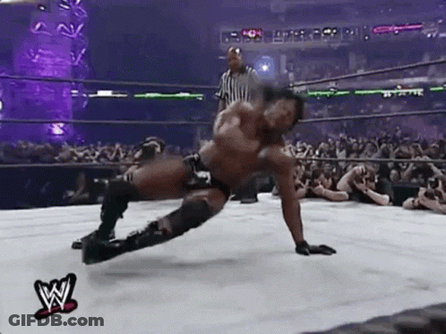 Wrestler Laying On Floor In Wrestling Ring GIF