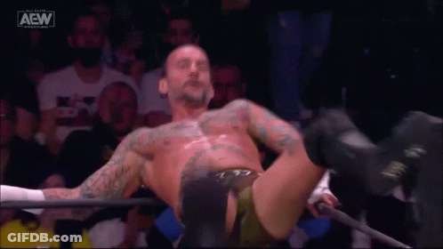 Wrestler Laying On Ground In Ring GIF