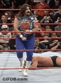 Wrestler Laying On Ground, Man Standing GIF