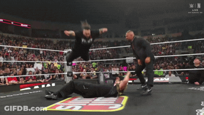 Wrestler Laying On Ring With Smackdown Logo GIF